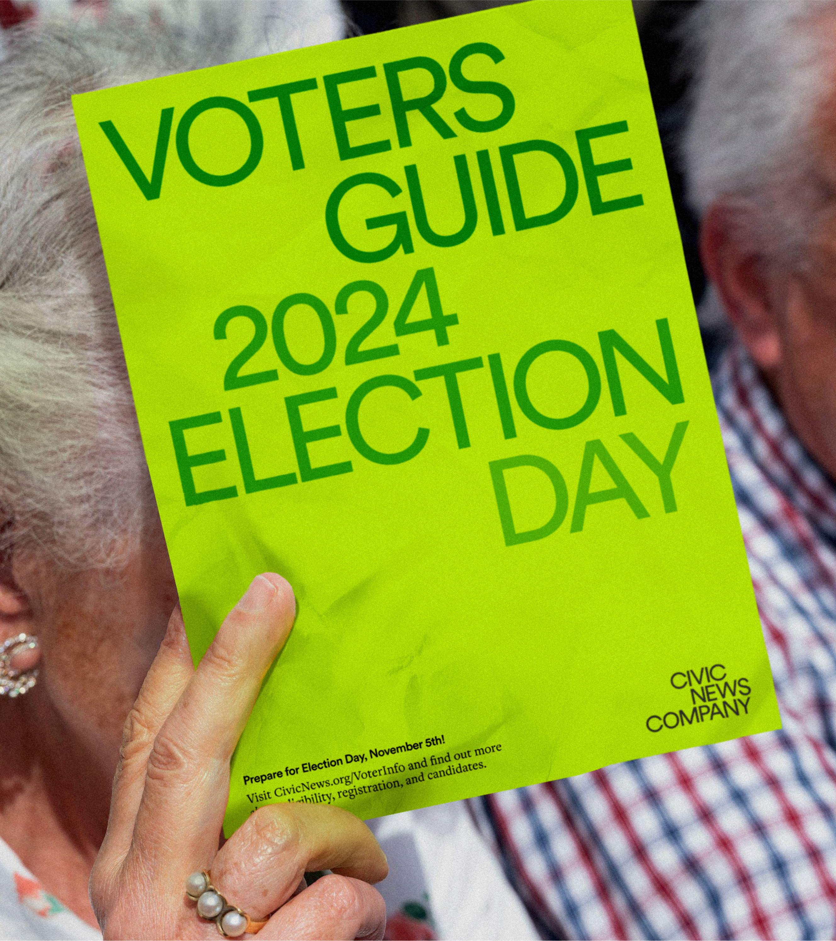 An image of an elderly woman holding up a sheet of paper that is a Civic News Company branded voters guide